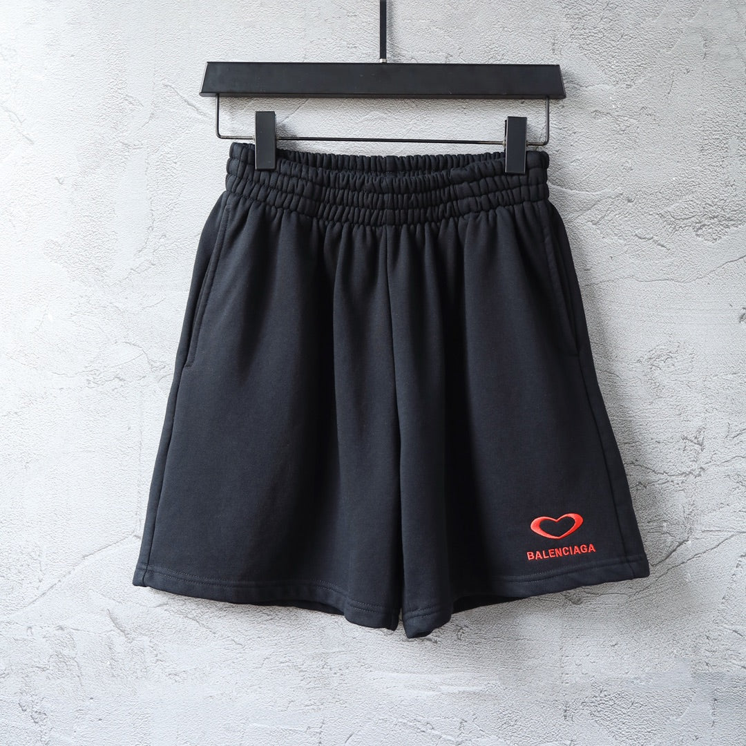 Balenciaga shorts in dark navy with elastic waistband and red heart logo patch
