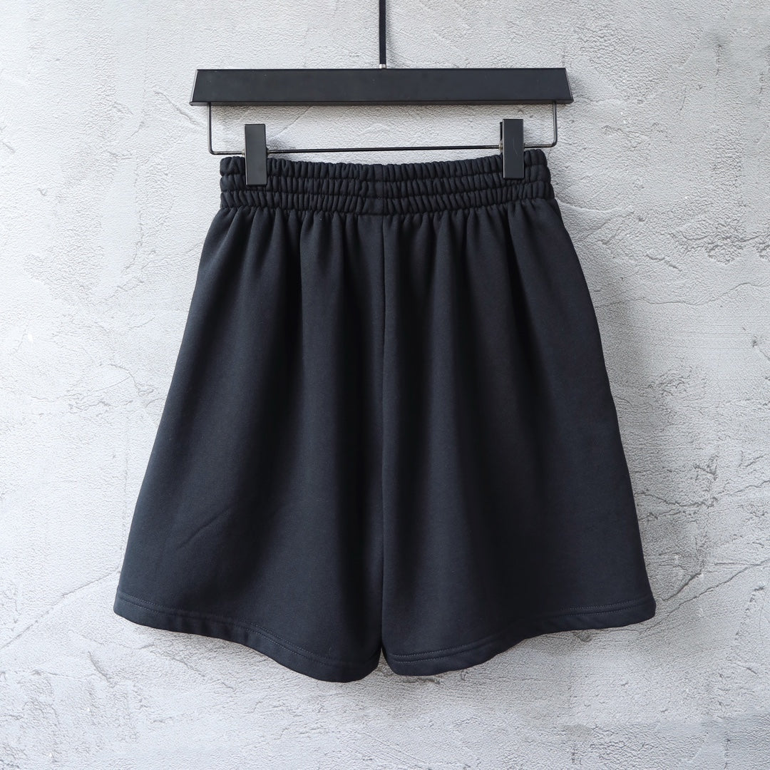 Balenciaga shorts with elastic waistband and small red logo on the front