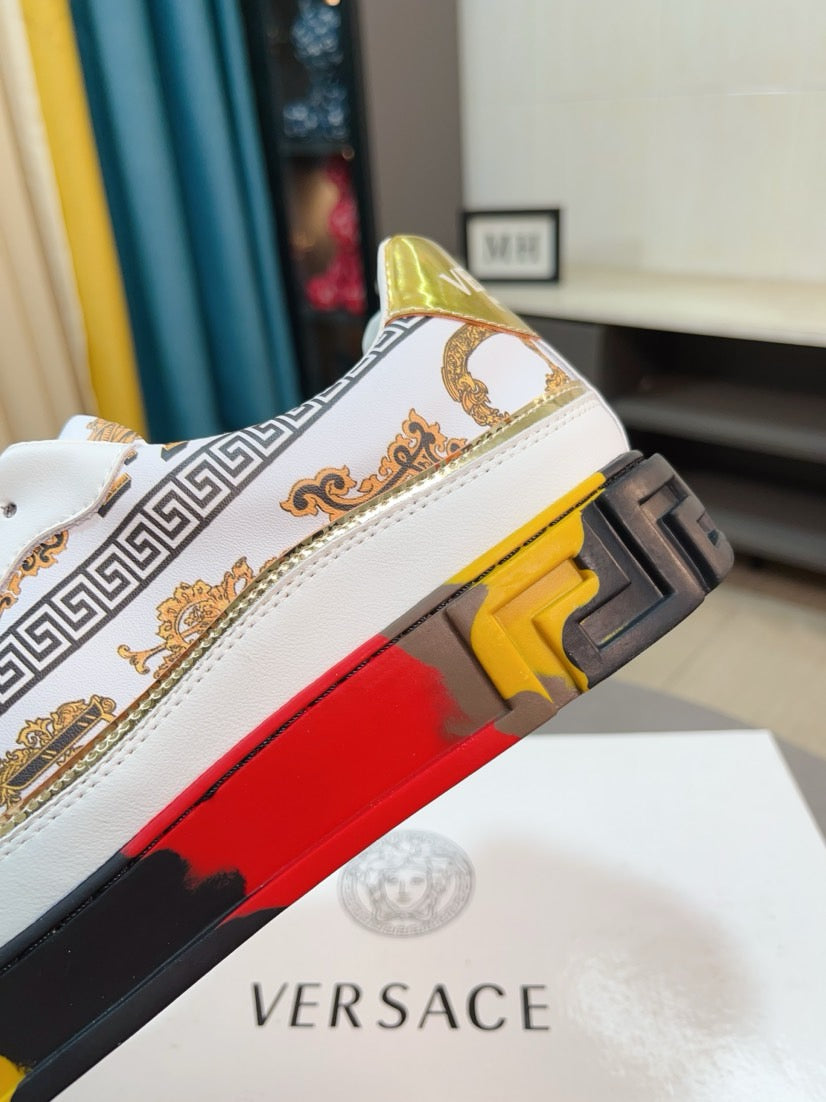 Versace luxury sneakers heel detail: white leather with gold crest and Greek stripe.