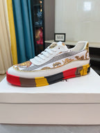 Versace luxury sneakers, white leather with Greek border trim and gold crest patch.