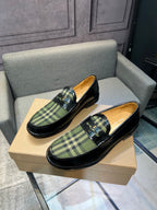 Burberry plaid loafers on beige box, black leather with green tartan slip-on style