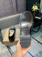 Burberry plaid loafers outsole, leather bottom with rivets and embossed brand text