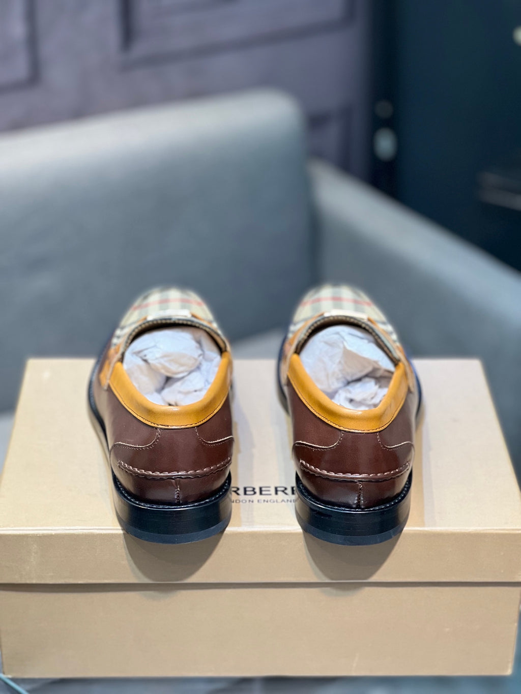Burberry loafers from back, brown leather with tan lining and black heel trim