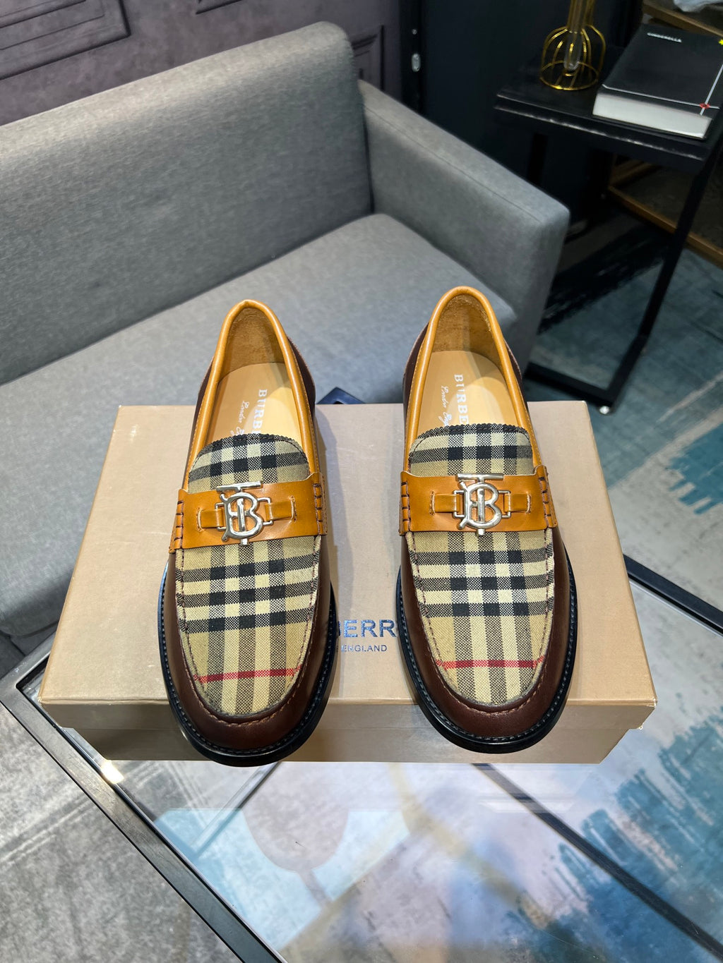 Burberry loafers featuring tan leather and blue, red, beige check uppers with gold buckle
