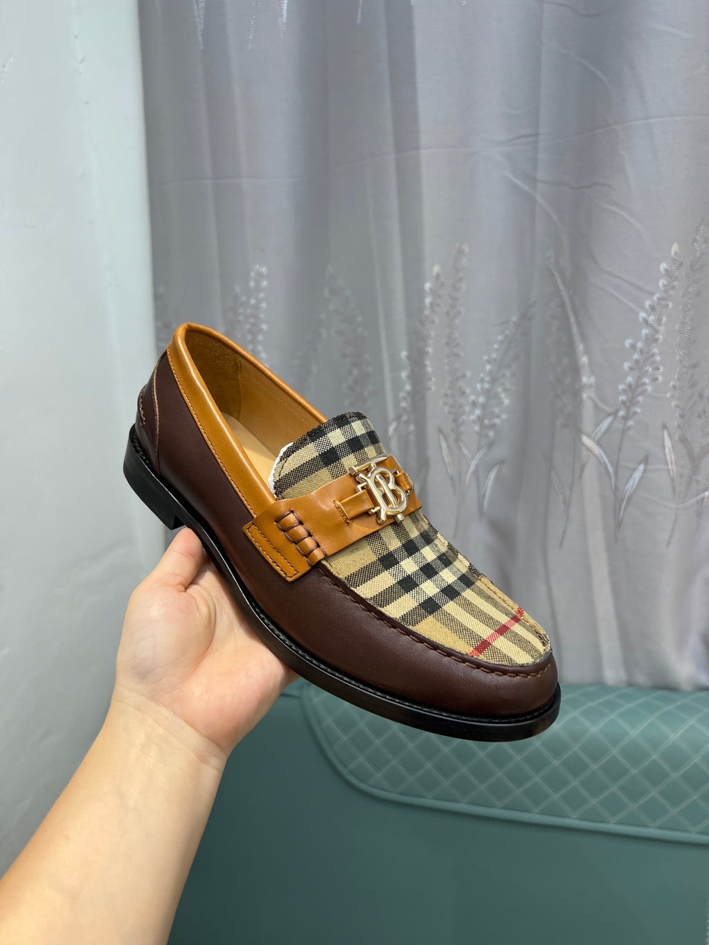 Burberry loafer on hand, tan leather upper with plaid panel and gold-tone buckle trim