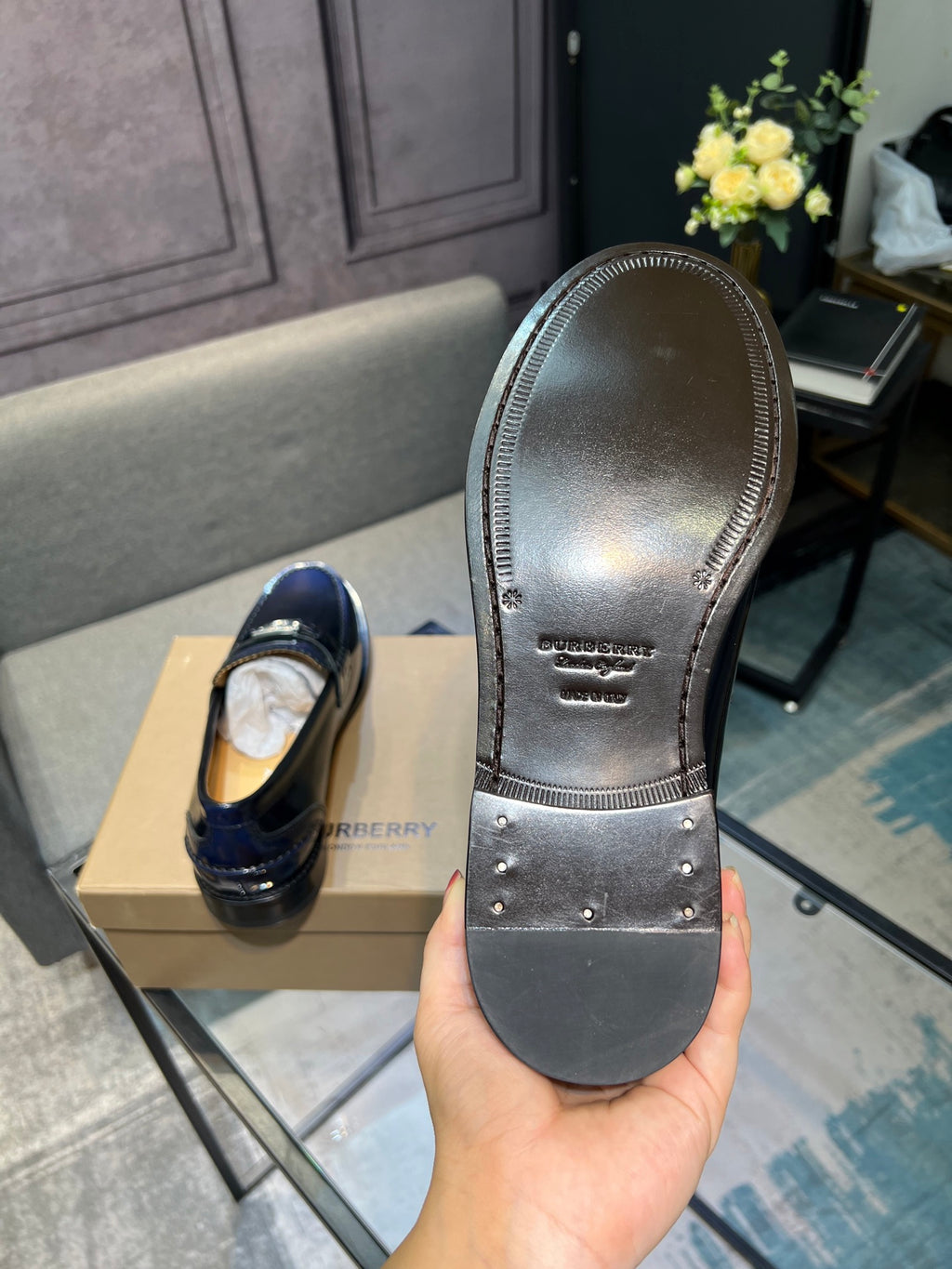 Burberry navy patent leather loafer outsole view with studded tread