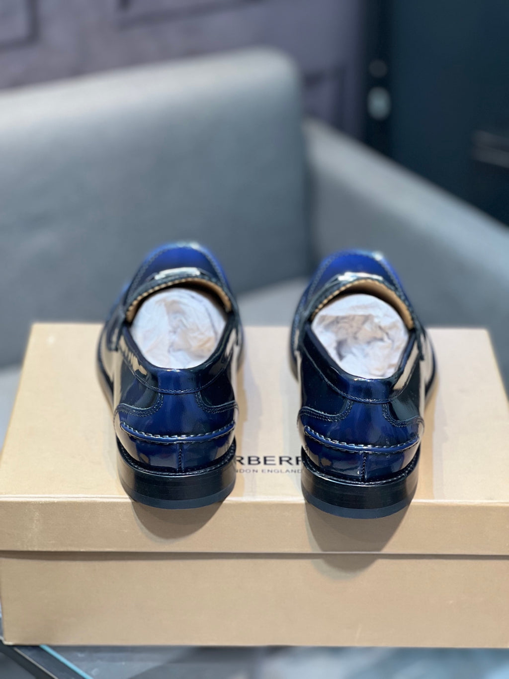 Burberry navy patent leather loafers with TB buckle detail, back view