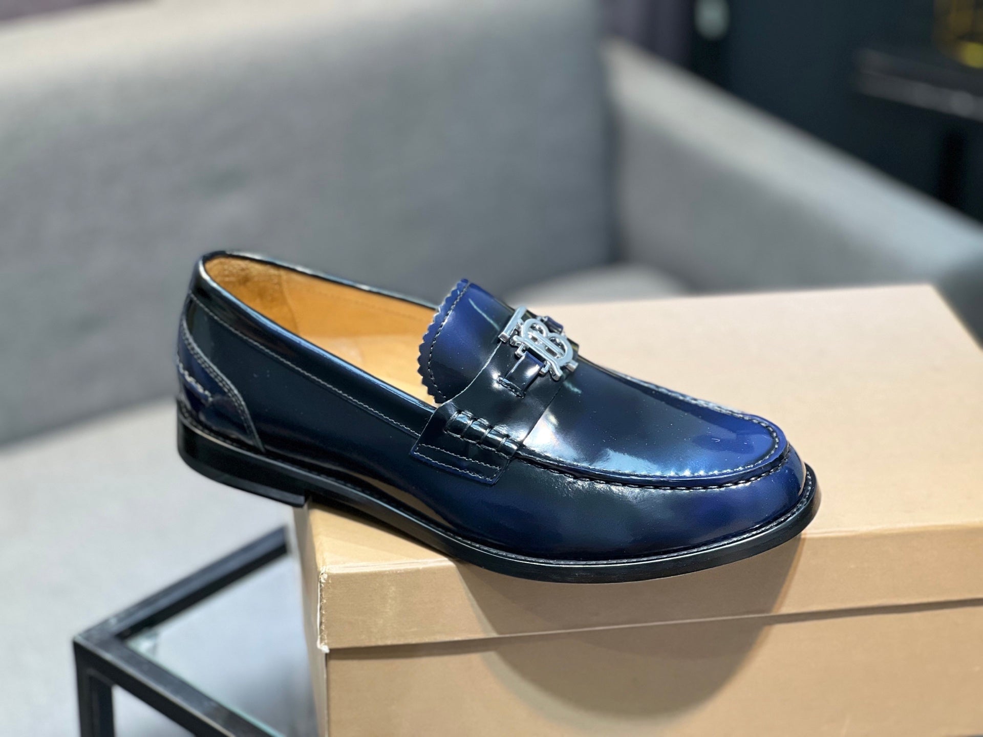 Burberry navy patent leather loafer, TB buckle detail, side profile