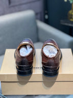 Brown leather loafers with TB hardware on toe and heel view