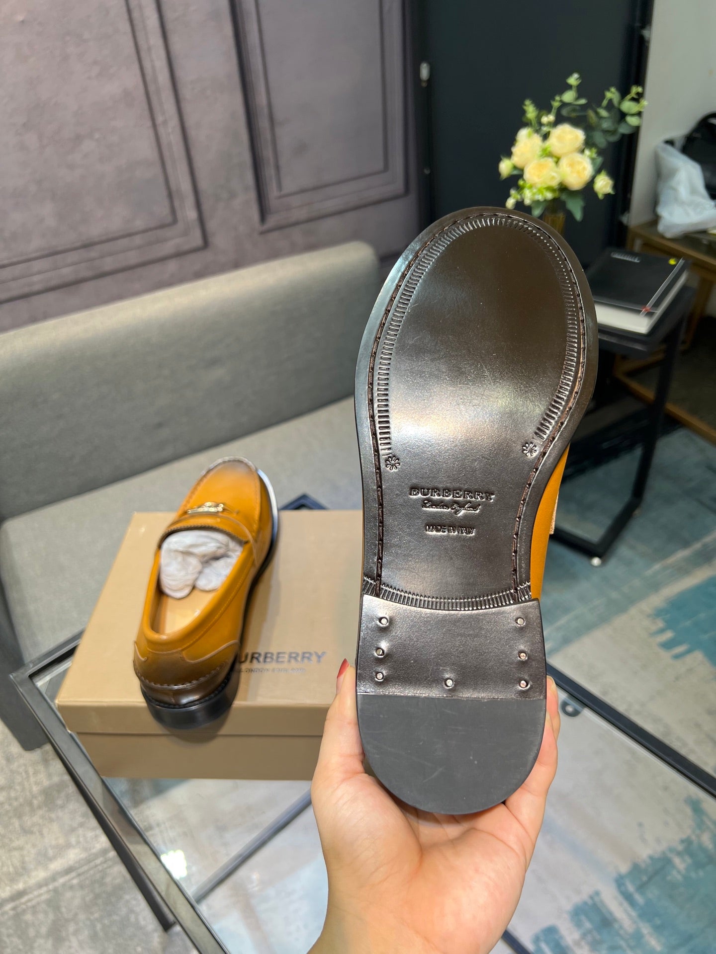 Burberry loafer outsoles, dark rubber with raised tread and brand text