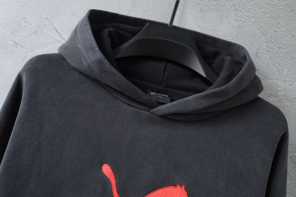 Charcoal gray Balenciaga hoodie sweatshirt with hood opening and red puma logo on chest