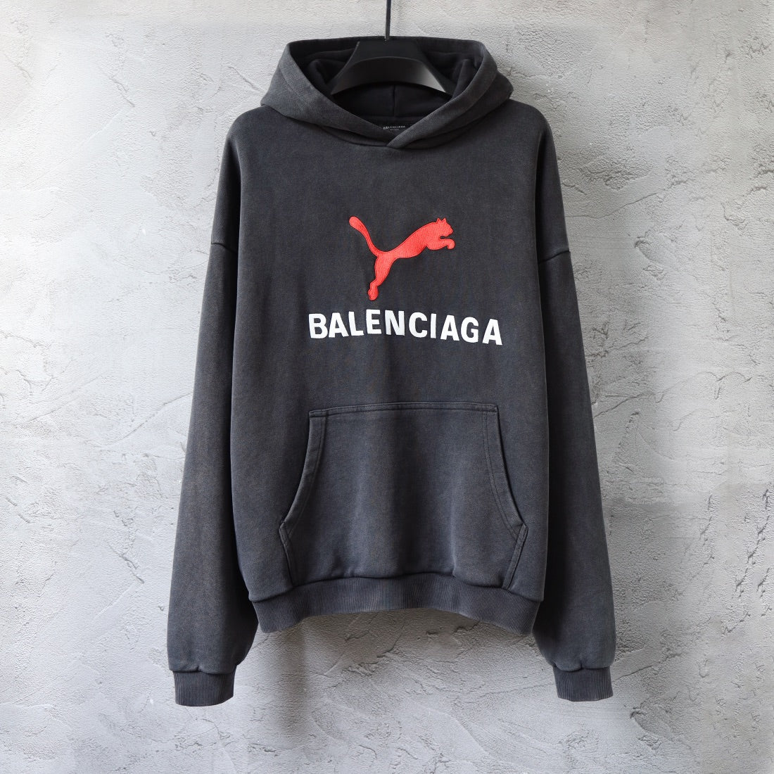 Charcoal gray Balenciaga hoodie sweatshirt with front pocket and red logo graphic