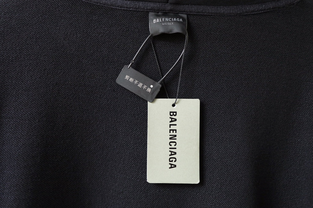 Black hoodie neckline with Balenciaga tags and care label on inner collar