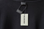 Black hoodie neckline with Balenciaga tags and care label on inner collar