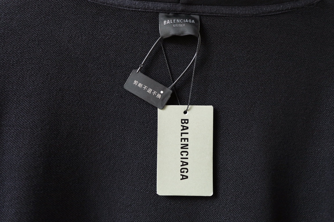 Black hoodie neckline with Balenciaga tags and care label on inner collar