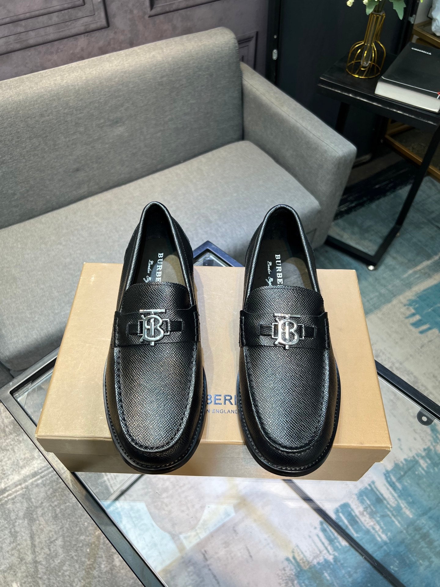 Burberry logo loafers, dark leather with apron toe stitching and metal emblem on top