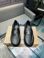 Burberry black leather loafers with metal TB logo and stitched moc toe, pair on box