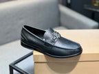 Burberry logo loafer, dark leather slip-on with metal emblem and apron toe stitching