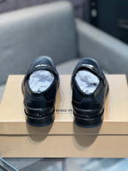 Burberry black leather loafers back view with stacked heel and rear stitching, pair