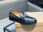 Burberry dark leather loafer with metal buckle, side view on box