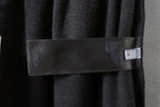 Interior size label on dark gray pants