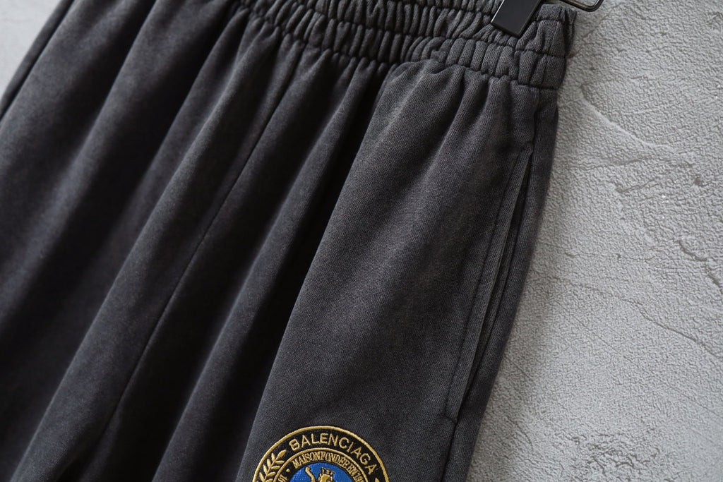 Balenciaga wide-leg pants with logo patch detail near hem, elastic waist.