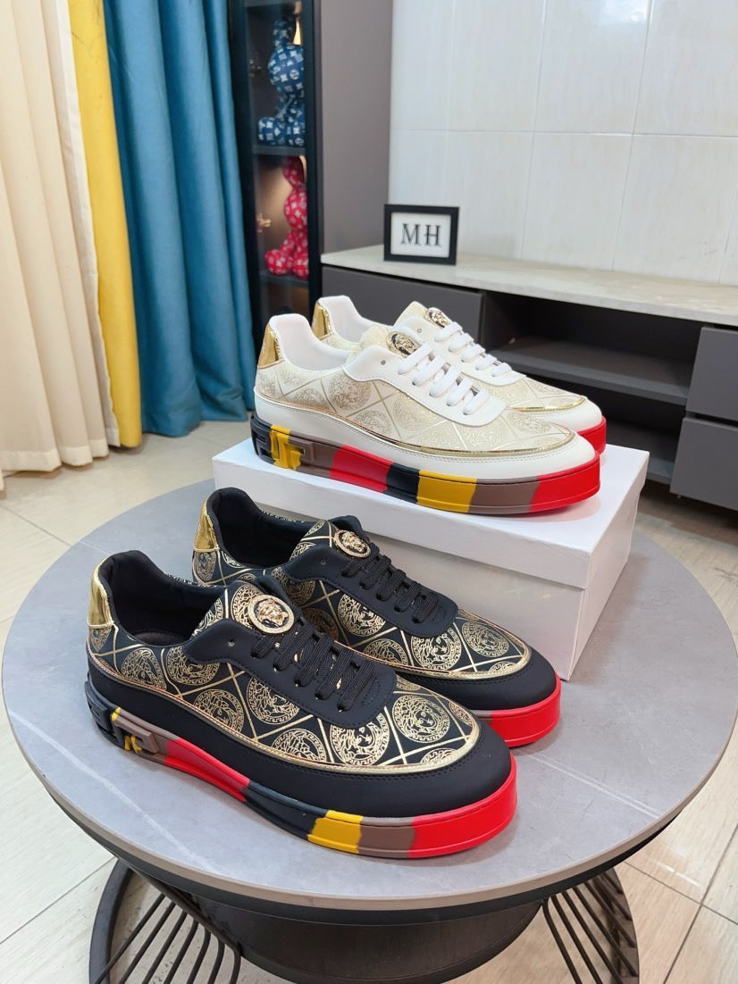White and gold low-top sneakers with ornate pattern, white laces, multicolor platform sole