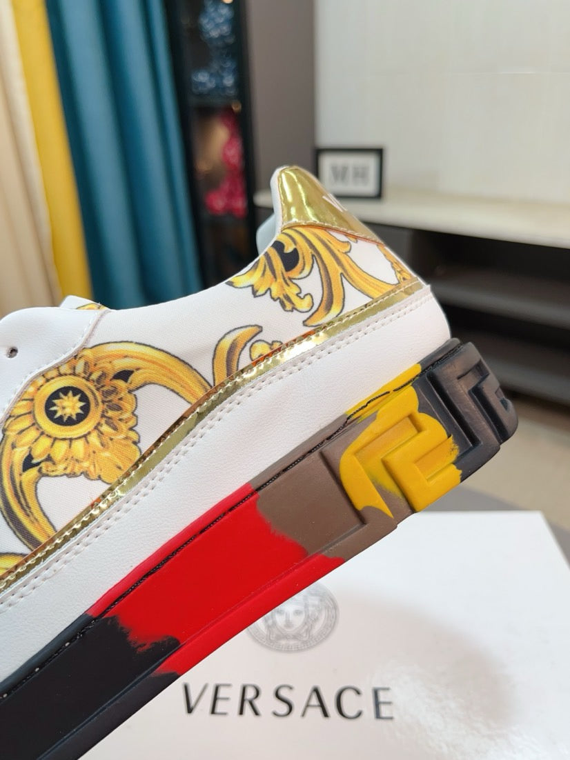 White luxury sneakers close-up of heel with gold print and textured platform outsole.