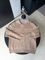 Beige zip-up hooded jacket with geometric logo lining, front zipper and side pockets