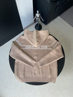 Beige zip-up hooded jacket with Christian Dior logo across chest panel