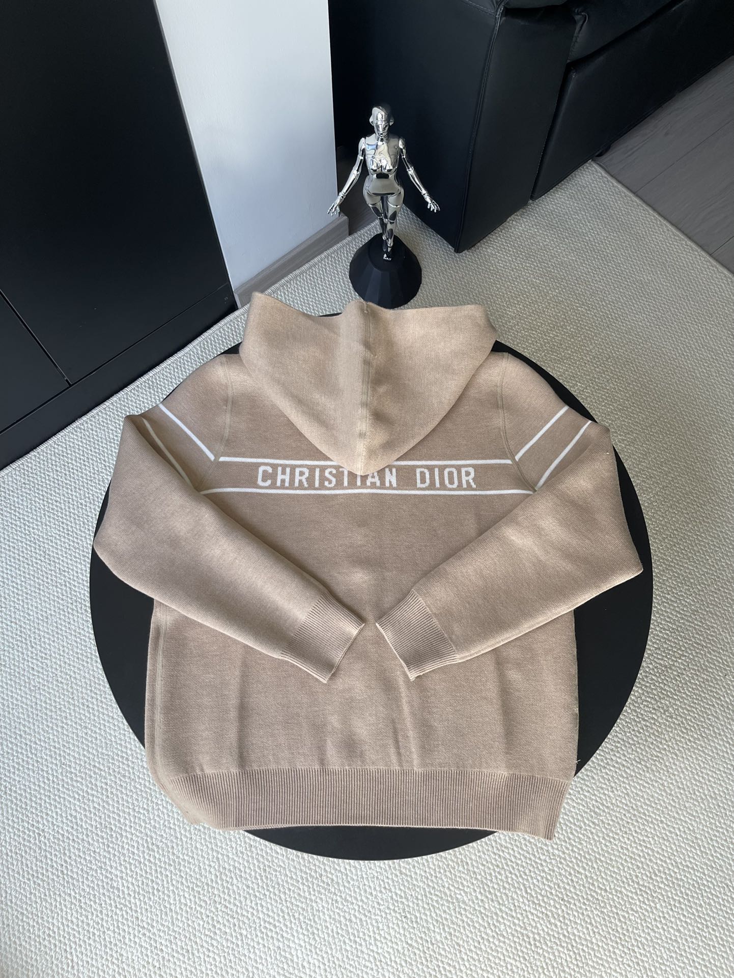 Beige zip-up hooded jacket with Christian Dior logo across chest panel