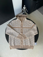 Beige hooded jacket with all-over geometric logo pattern and front zip