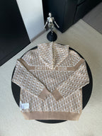 Beige hooded jacket with geometric logo pattern and Christian Dior logo on chest
