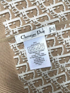 Clothing label inside beige hooded jacket with size and fabric details