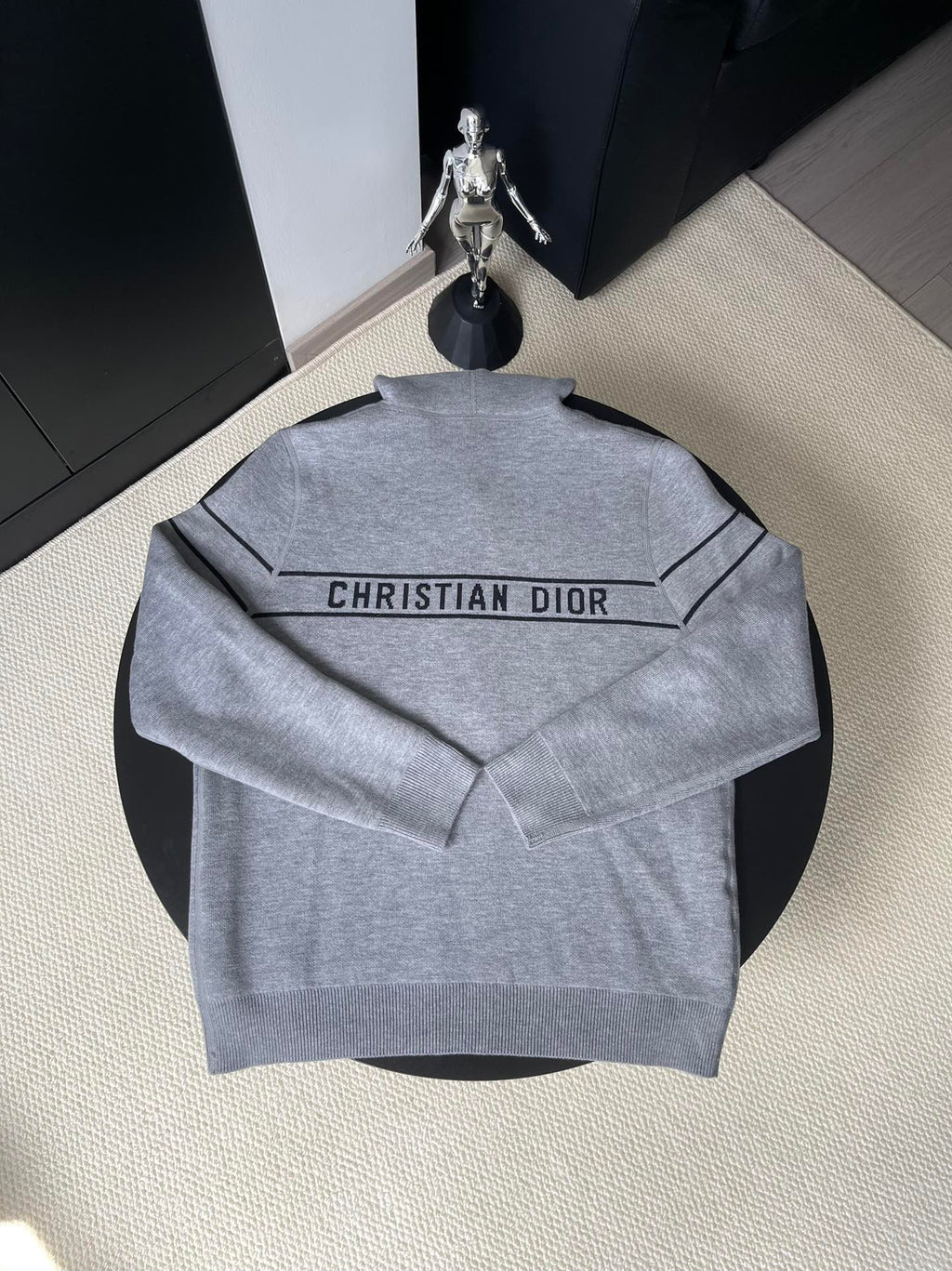 Gray hooded zip-up sweater back with “CHRISTIAN DIOR” logo across the yoke