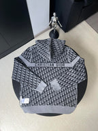 Black and gray patterned hooded zip-up sweater back with “CHRISTIAN DIOR” logo