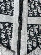 Close-up of black zipper on patterned knit hooded sweater front