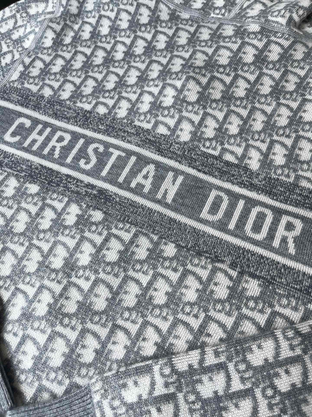 Gray hoodie band with 'CHRISTIAN DIOR' lettering over monogram pattern