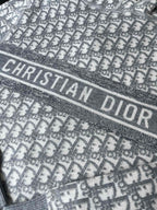 Gray hoodie band with 'CHRISTIAN DIOR' lettering over monogram pattern