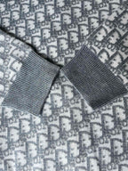 Gray patterned hoodie with ribbed cuff and shoulder seam detail