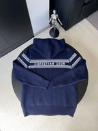 Back of navy Dior knit sweater with 'CHRISTIAN DIOR' logo band across yoke