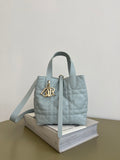 Dior light-blue quilted mini handbag with double top handles and gold logo charm