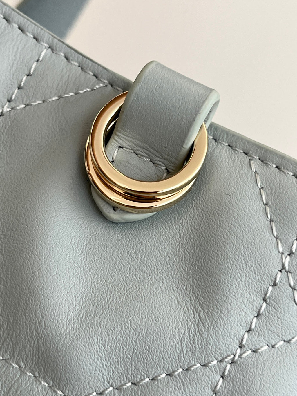 Dior light-blue handbag top handle ring with gold-tone hardware and stitched panel