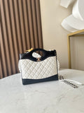 Chanel quilted mini bag with black handle, white body, gold CC logo
