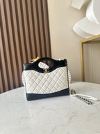 Chanel quilted mini bag with black handle, white body, gold CC logo