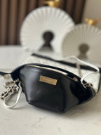 Chanel mini crossbody bag with gold logo plate, black leather and chain strap