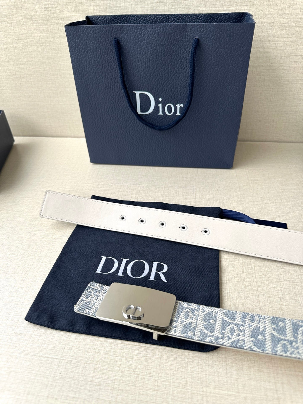 Dior belt with white leather strap, blue monogram panel, silver D buckle