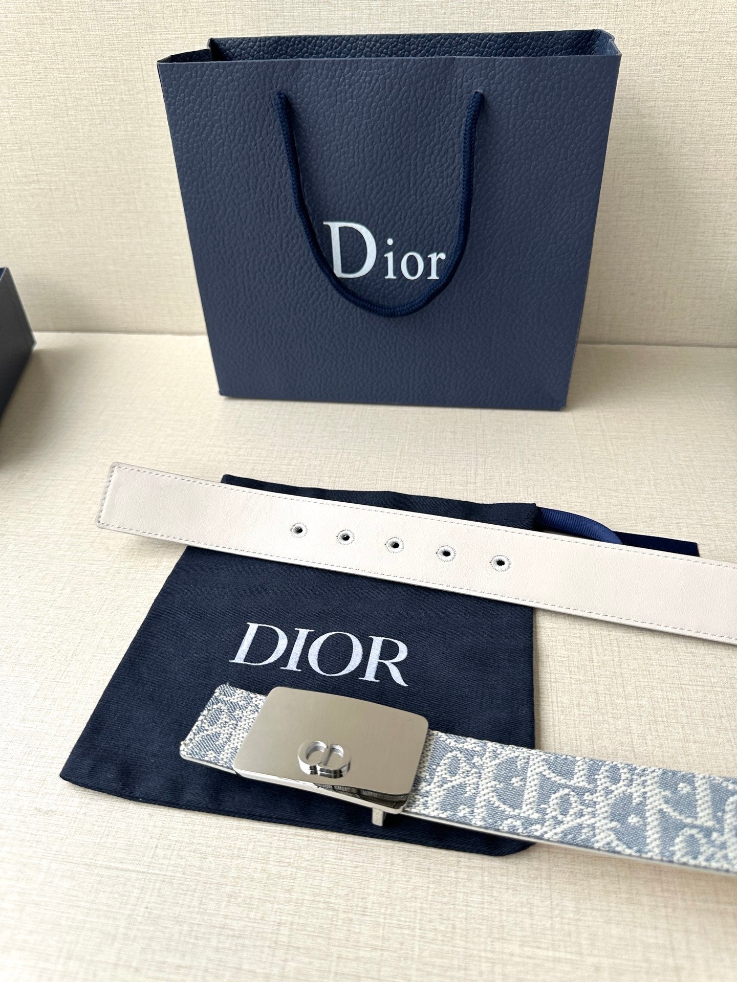 Dior belt with white leather strap, blue monogram panel, silver D buckle