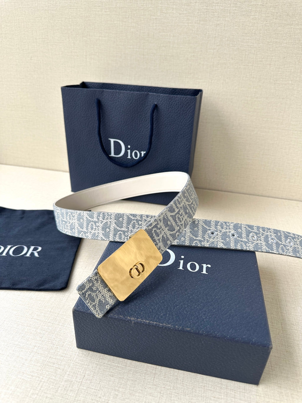 Dior belt with blue monogram pattern and gold-tone buckle