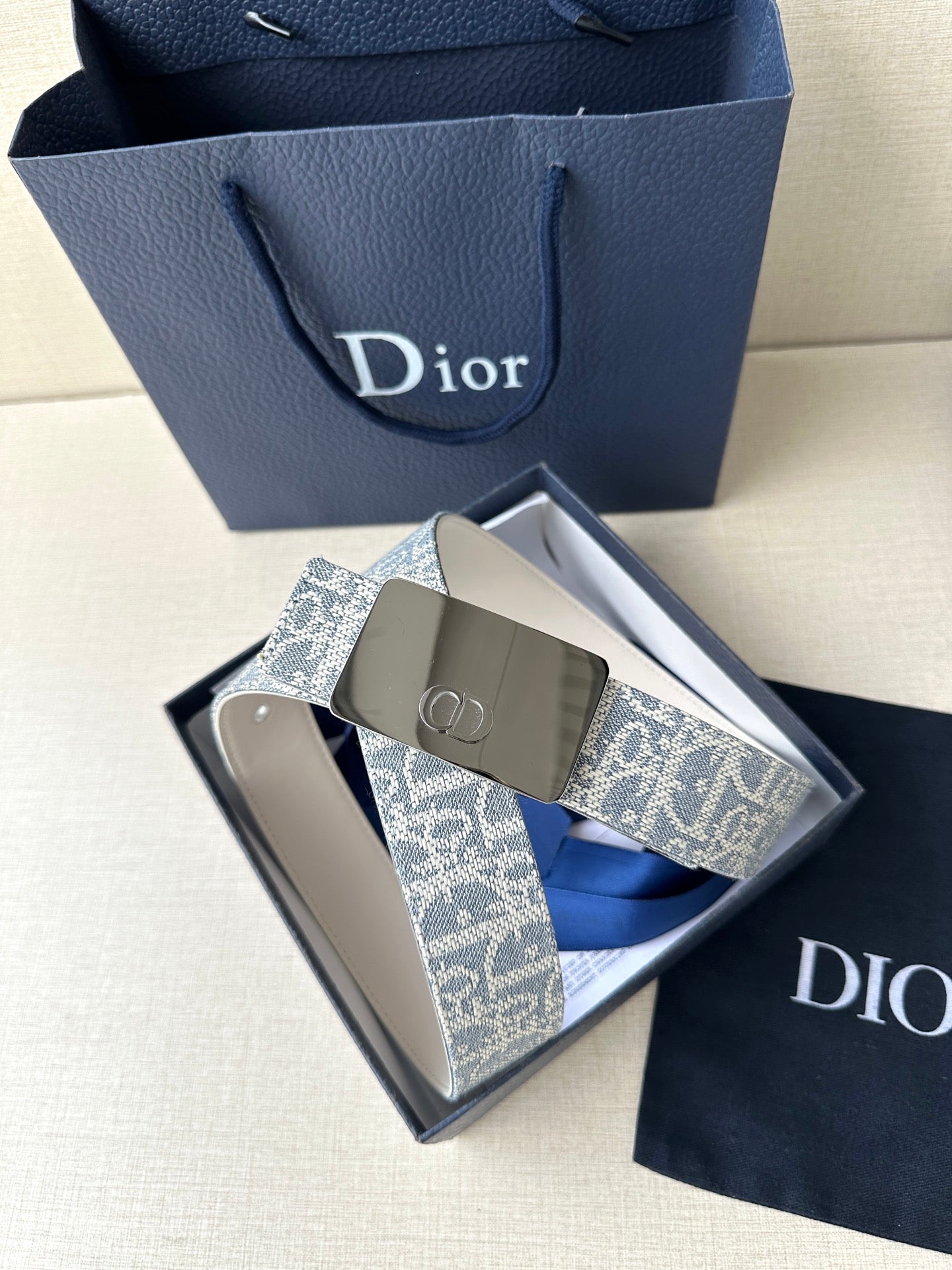 Dior belt set: blue monogram strap with silver buckle and beige underside